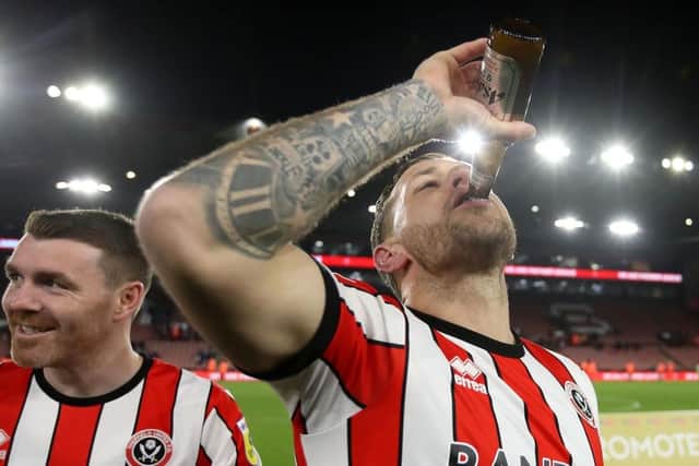 DRINKING IT IN: Sheffield United captain Billy Sharp celebrates promotion with a beer