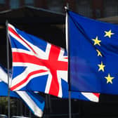 The Union and European Union flags side by side. PIC: PA