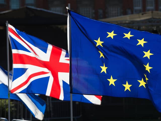 The Union and European Union flags side by side. PIC: PA