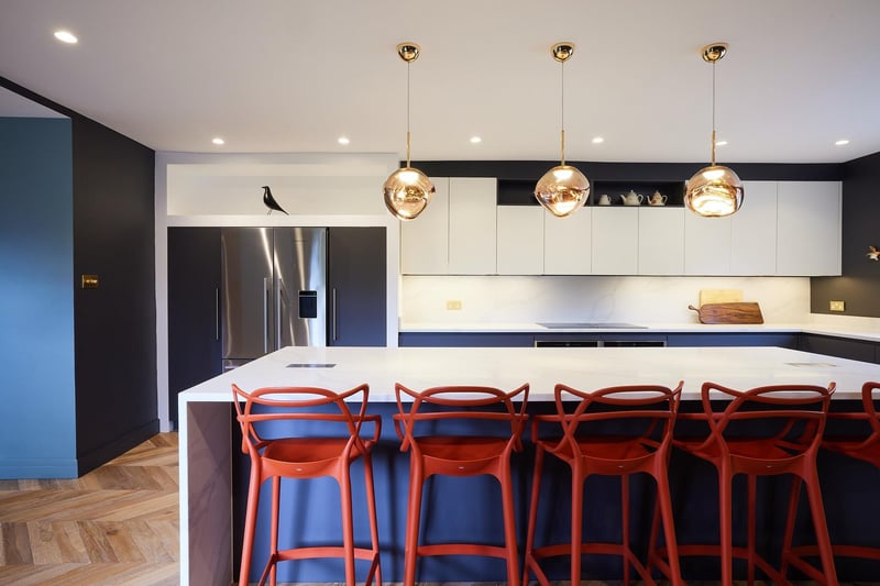 The kitchen is a sociable space thanks to the central island with seating