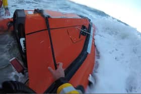 The video shows the dramatic rescue of the walkers on the Yorkshire coast. (Credit: RNLI)