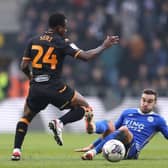 CONTEST: Harry Winks tackles Hull City midfielder Jean Michael Seri