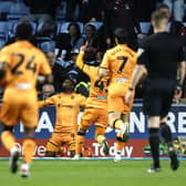Hull City's Noah Ohio (centre) celebrates scoring their side's third goal of the game with team-mates during the Sky Bet Championship match at Coventry. Photo: Nigel French/PA Wire.