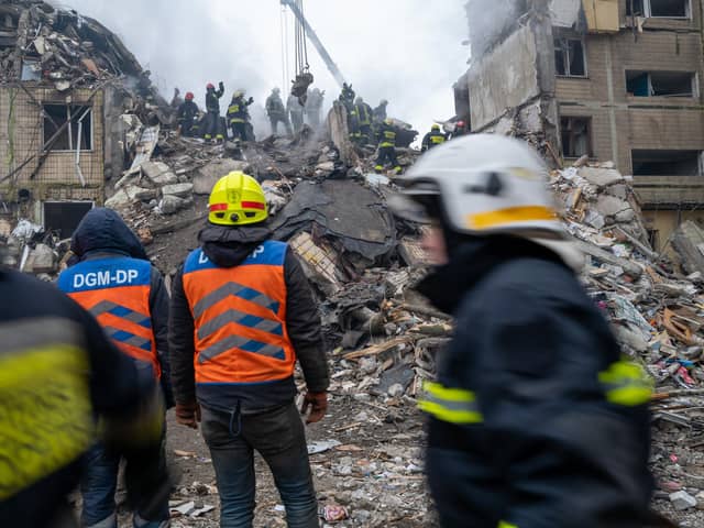 Emergency workers search the remains of a residential building that was struck by a Russian missile yesterday on January 15, 2023 in Dnipro, Ukraine. PIC: Spencer Platt/Getty Images