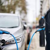 An electric car charging. Picture: PA/John Walton