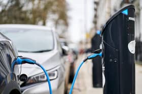 An electric car charging. Picture: PA/John Walton