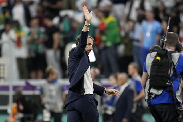 HAPPY DAYS: England's head coach Gareth Southgate waves to fans after his side's 3-0 win over Senegal at the Al Bayt Stadium Picture: AP Photo/Abbie Parr