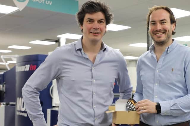 Instantprint founders Adam Carnell and James Kinsella pictured with the firm's millionth customer artwork order.