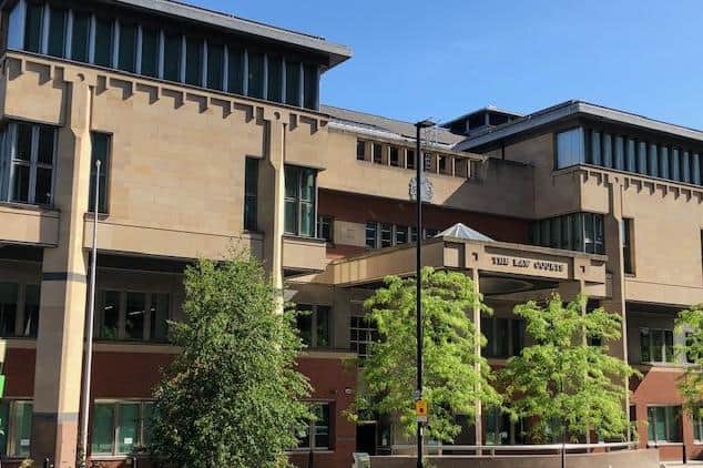 Sheffield Crown Court, pictured, has heard how 'racist' paranoid schizophrenic James Lee, of East Dene,  Rotherham, has been detained indefinitely in a secure, mental health hospital after he pleaded guilty to manslaughter following the fatal stabbing of Mohamed Issa Koroma in Sheffield city centre.