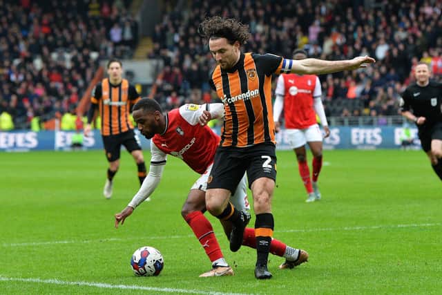 BATTLE: Hull City's Lewie Coyle competes for the ball with Tariqe Fosu of Rotherham United