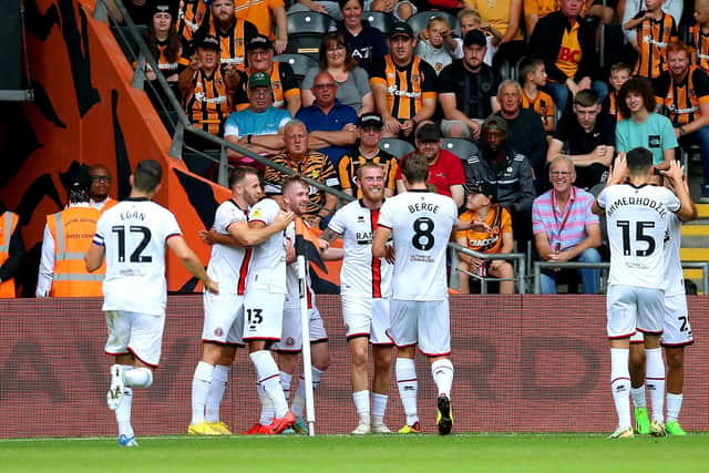 Sheffield United's Oliver McBurnie (centre) celebrates with his team-mates after scoring their side's first goal of the game at Hull City. Picture: Nigel French/PA Wire.