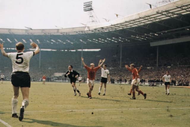OWLRD CHAMPION: Bobby Charlton (centre) celebrates England's controversial third goal during the 1966 World Cup final