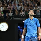 King of Melbourne: Serbia's Novak Djokovic gestures to the crowd as he celebrates a 10th men's singles title at the Australian Open in Melbourne (Picture: MANAN VATSYAYANA/AFP via Getty Images)