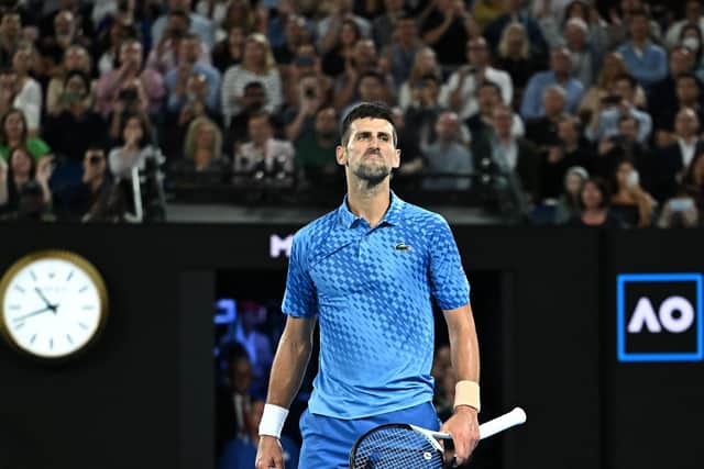 King of Melbourne: Serbia's Novak Djokovic gestures to the crowd as he celebrates a 10th men's singles title at the Australian Open in Melbourne (Picture: MANAN VATSYAYANA/AFP via Getty Images)