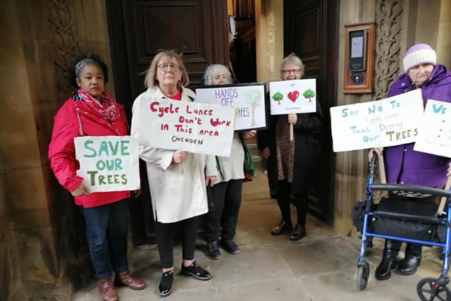 Some of the Ovenden and Illingworth residents held a silent placard protest outside Halifax Town Hall about the proposed cycle lanes as councillors arrived