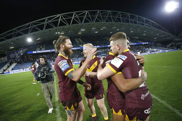 Huddersfield Giants players celebrate the win over Castleford Tigers. (Photo: Ed Sykes/SWpix.com)