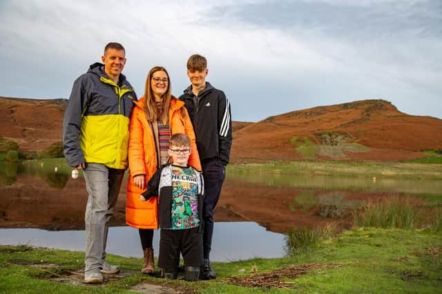 Luke Mortimer, 10, with his parents and brother Harry