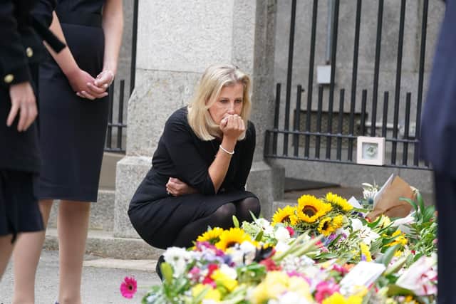 The Countess of Wessex views the messages and floral tributes left by members of the public at Balmoral.
