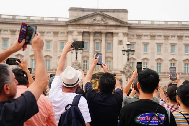 Crowds watching the Changing of the Guard ceremony at Buckingham Palace in London, on the first anniversary of Queen Elizabeth II's death. PIC: Victoria Jones/PA Wire