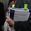 A person holds a copy of the UK Covid-19 inquiry - module 6. PIC: Jeff Moore/Press Association