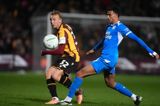Bradford City's George Lapslie and Peterborough United's Brandon Khela battle for the ball during the Carabao Cup, fourth round match at Mbanq Valley Parade, Bradford. Picture date: Tuesday October 27, 2026.