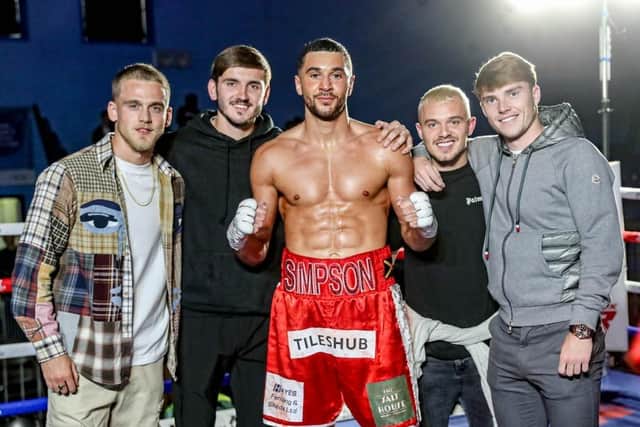Barnsley boxer and Central Area super middleweight champion Callum Simpson with players of Barnsley FC. Picture: Karen Priestley.