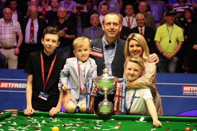 Mark Williams of Wales pose for a picture with his family and with his trophy after winning the tournament during day seventeen of World Snooker Championship at Crucible Theatre on May 7, 2018 (Picture: Linnea Rheborg/Getty Images)