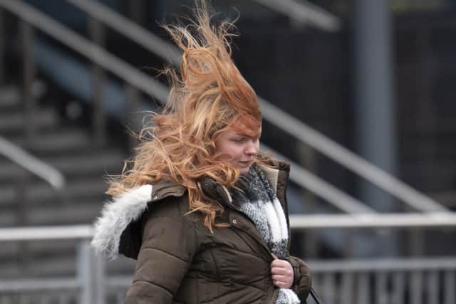 A Lady Braves the windy conditions in Leeds centre as Storm Arwen arrives (Nov 2021)