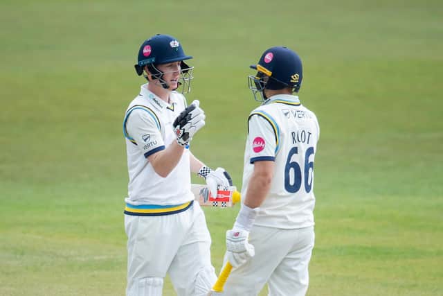 Brook is congratulated on his century by Joe Root, who also reached three figures. Picture by Allan McKenzie/SWpix.com
