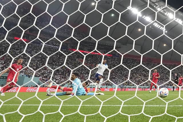 England's Marcus Rashford scores his side's fifth goal against Iran (AP Photo/Martin Meissner)