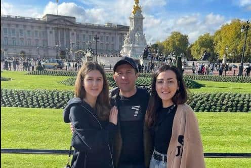 Polina, Sergiy and Olga on a visit to Buckingham Palace in London. Submitted by Olga Fedchenko.