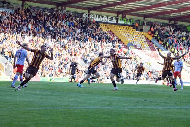 Ecstatic Bradford City players herald Antoni Sarcevic's late winner. Photo: Tony Johnson.