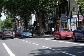 Cars pass along Ecclesall Road in Sheffield. Picture: Dean Atkins