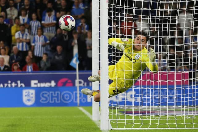 HUDDERSFIELD, ENGLAND - JULY 29: Lee Nicholls of Huddersfield Town dives as the ball ricochets of the post during the Sky Bet Championship match between Huddersfield Town and Burnley at John Smith's Stadium on July 29, 2022 in Huddersfield, England. (Photo by Ashley Allen/Getty Images)