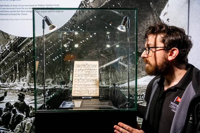 Joe Levy, Exhibition Manager for White Star Heritage, looking at sheet music from Wallace Hartley, the Titanic's band leader. Hartley spent much of his life in Yorkshire after his family moved to Huddersfield. Picture: James Hardisty.