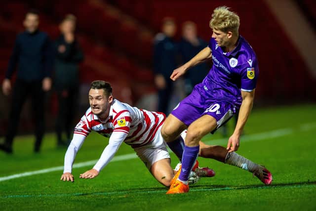 FALL GUY: But Luke Molyneux (left) is finally up and running as a Doncaster Rovers goalscorer