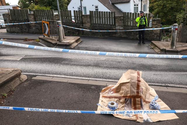 Police cordon near the scene in Woodhouse Hill, Huddersfield, where a 15-year-old boy was stabbed and later died in hospital on Wednesday