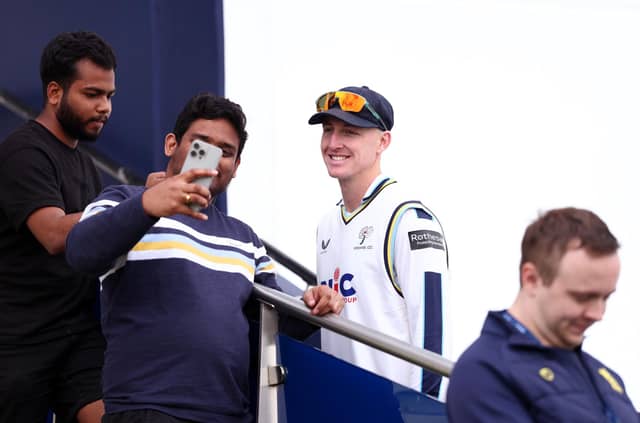 Harry Brook poses for a photo with fans. Photo by Dan Istitene/Getty Images