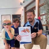 Four-year-old Alexander Dunn, from Dewsbury, presented with his Young Persons Certificate of Commendation from the Royal Life Saving Society UK (RLSS UK) by RLSS UK Mentor and Course Tutor Garry Hume and his swim teacher from Swimbabes Fiona Mellor.