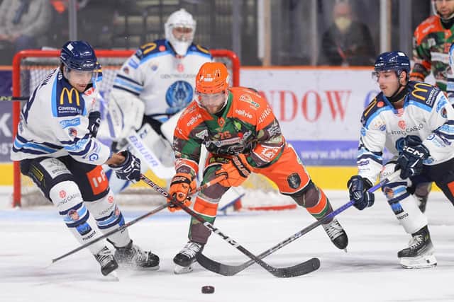 LEADING MAN: Robert Dowd battles for possession against Coventry Blaze, the Steelers' captain going on to score the overtime winner in a 2-1 victory at the Utilita Arena. Picture courtesy of Dean Woolley/Steelers Media.