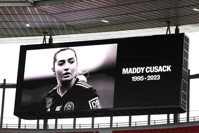 A tribute to Sheffield United player Maddy Cusack is shown on the big screen during a Barclays Women's Super League match