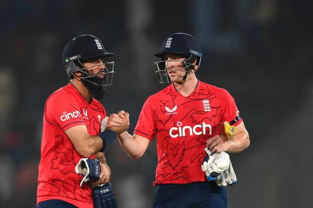 Moeen Ali and Harry Brook of England celebrate victory after the 1st IT20 match between Pakistan and England at Karachi National Stadium on September 20, 2022 in Karachi, Pakistan. (Picture: Alex Davidson/Getty Images)