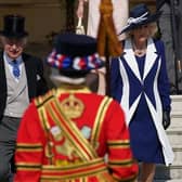 King Charles III and the Queen Consort walk down the steps to meet guests attending a Garden Party at Buckingham Palace, London, in celebration of the coronation. PIC: Yui Mok/PA Wire