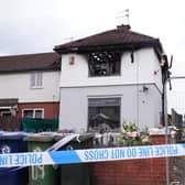 Police officers at the scene on Birchington Avenue, Grangetown, near Middlesbrough, where Valentina Foster, aged seven, and Natalie McDonald, 34, died following a fire at an end-of-terrace property on Wednesday morning.  Owen Humphreys/PA Wire