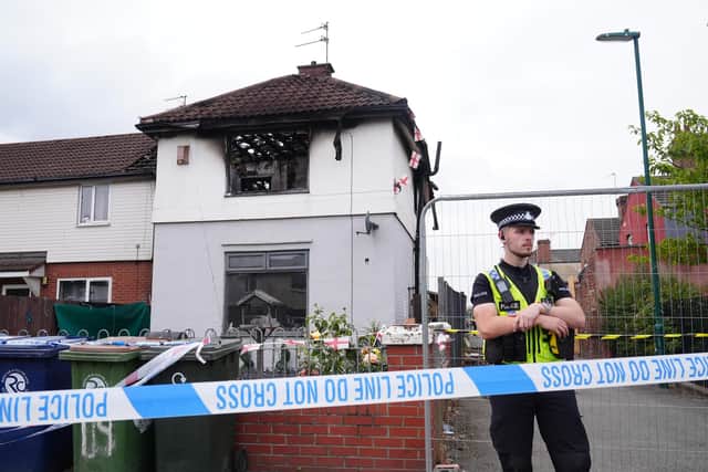 Police officers at the scene on Birchington Avenue, Grangetown, near Middlesbrough, where Valentina Foster, aged seven, and Natalie McDonald, 34, died following a fire at an end-of-terrace property on Wednesday morning.  Owen Humphreys/PA Wire