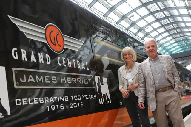 Rosie Page and Jim Wight with the Grand Central train, James Herriot,  at Kings Cross. Picture by Dawn McNamara