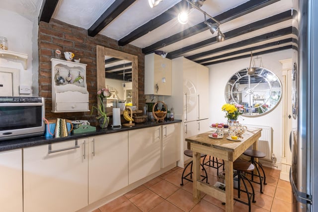The kitchen has plenty of space for everything you need including a dining table