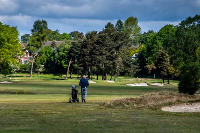 Golfers returning to their clubs today for the first time since the UK Lockdown after the governments announcement to ease some restriction during Coronavirus pandemic and restart the economy. Pictured Chris Pennington, walks down the fairway at Moortown Golf Club, Leeds, on May 13, 2020 (Picture: James Hardisty)