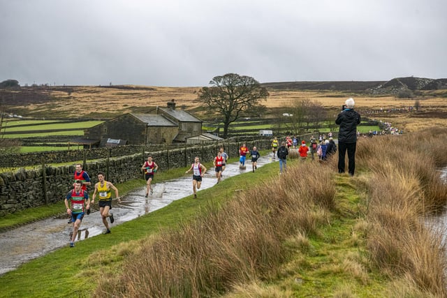 31 December 2022.....      Runners set off onto the moors at the start of the Auld Lang Syne fell race at Haworth for the annual New Years Eve event.  Picture Tony Johnson