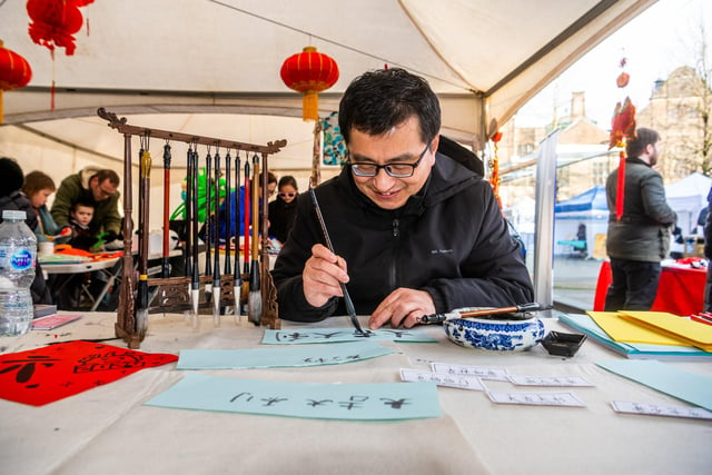 Daojian Zhang, showing the art of Chinese Calligraphy.